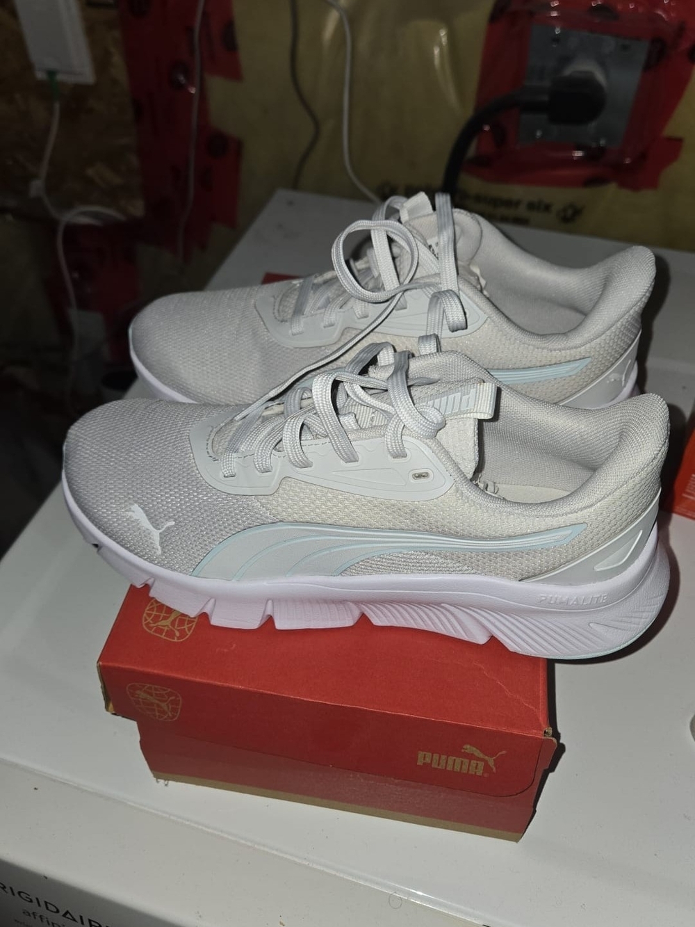 PUMA Women's White Athletic Sneakers with Light Blue Accent